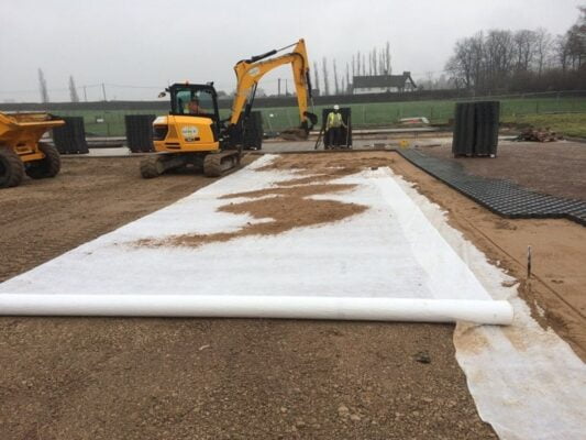 picture image of geotextile membrane being rolled out