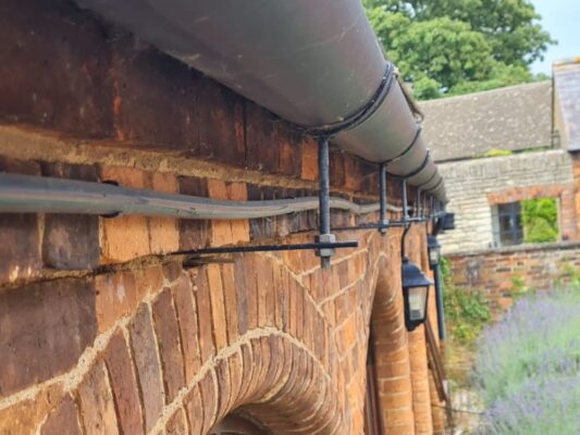 product installation image of rise and fall brackets for guttering
