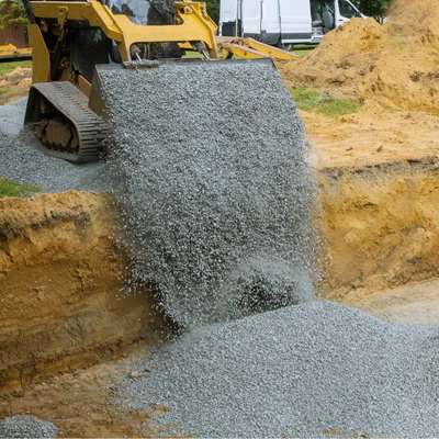 image of backfilling a trench for choosing a herringbone drainage system 