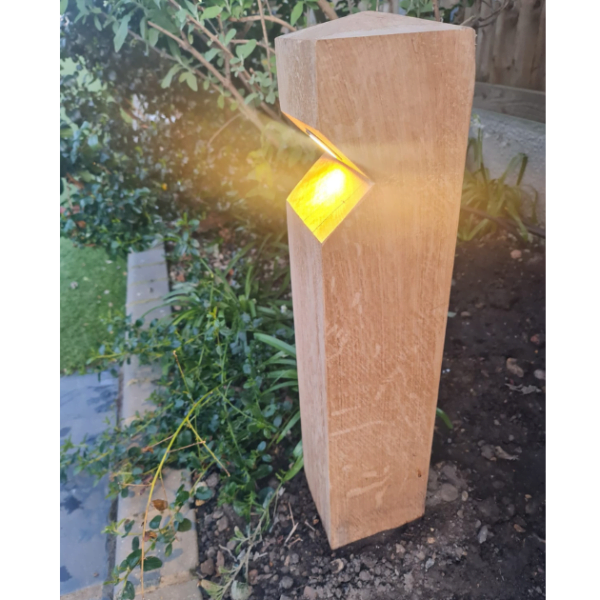 photograph of stratton single wooden bollard light with leds switched on - oak wood