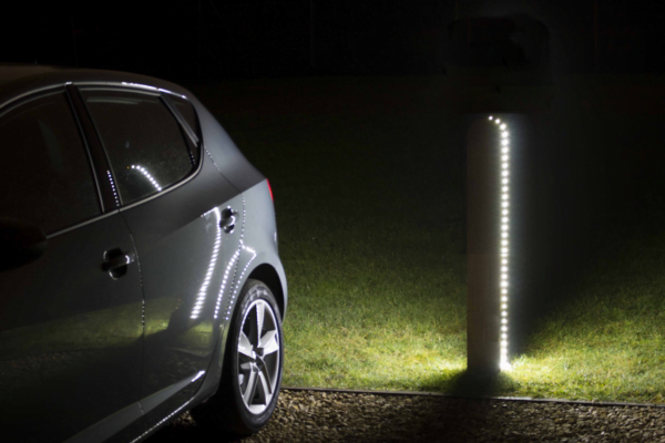 product gallery image of sway flow timber bollard with led lights installed outside in the dark