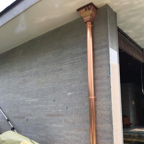 picture of copper hopper head - catherine and copper downpipe round installed