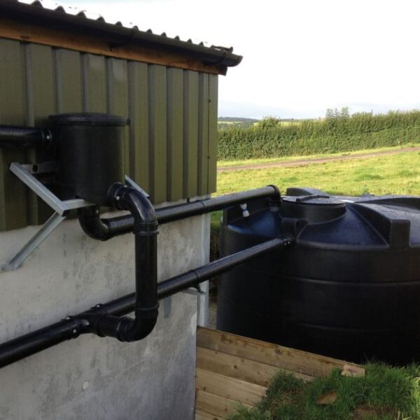 image of enduramaxx rainwater harvesting kit installed onto farm building using soil pipe