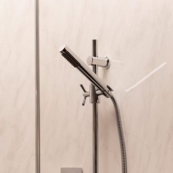 photograph of storm light grey marble shower panel installed in shower