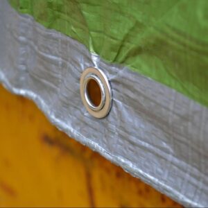 close up of metal eyelets on faithfull tarpaulin sheet - 5.4 x 3.6m